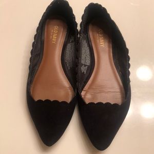 Black pointed flats with scalloped detail